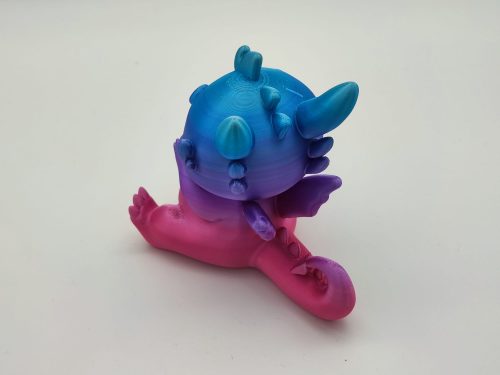 Baby-Drachenfigur mit Donut