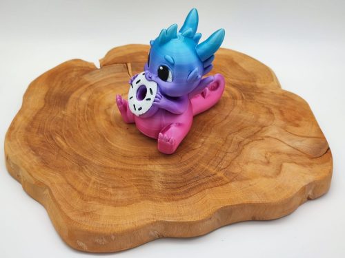 Baby-Drachenfigur mit Donut